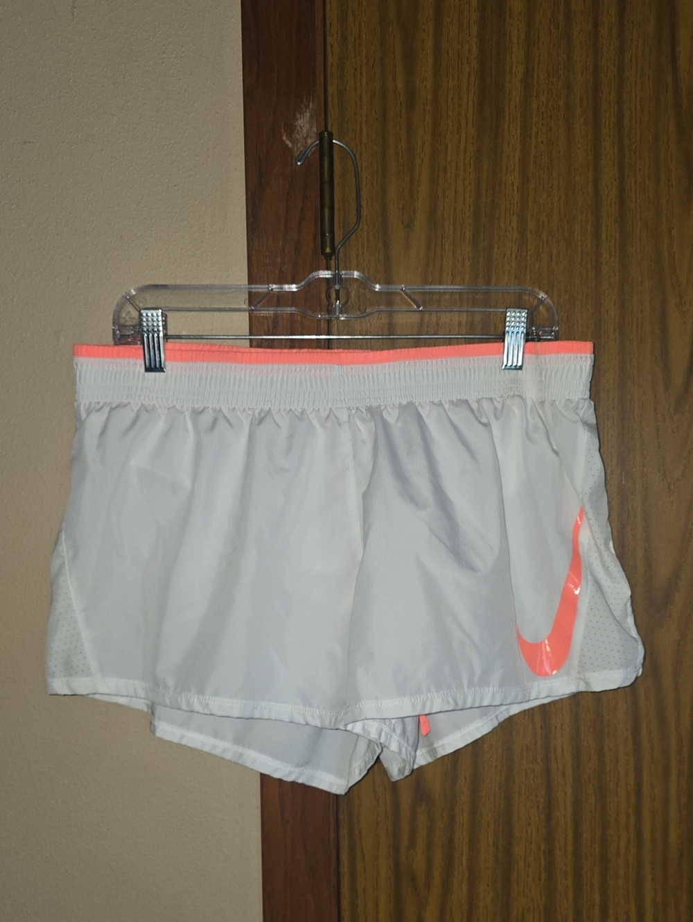 Nike Women’s White Athletic Shorts with Neon Coral Accent